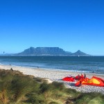 CPT Bloubergstrand beach with Table Mountain and kite surfers b
